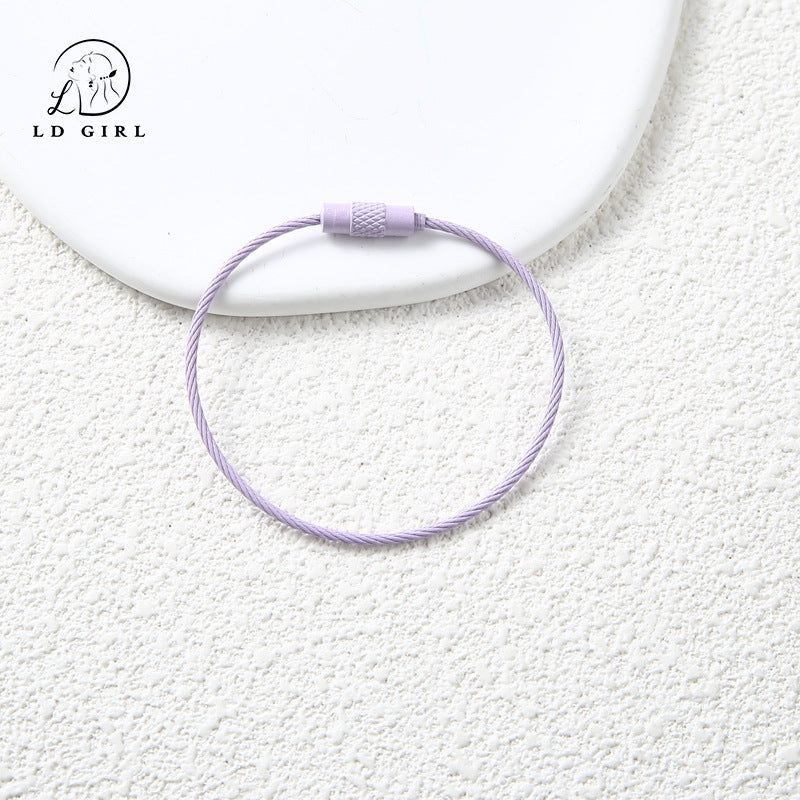 A candy colored wire rope ring