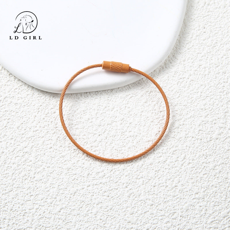 A candy colored wire rope ring