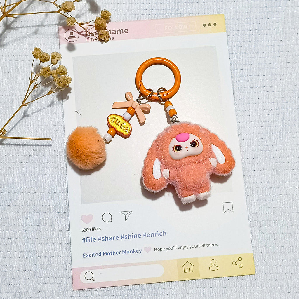 Bow flocked big-eared doll, cartoon keychain three-dimensional doll