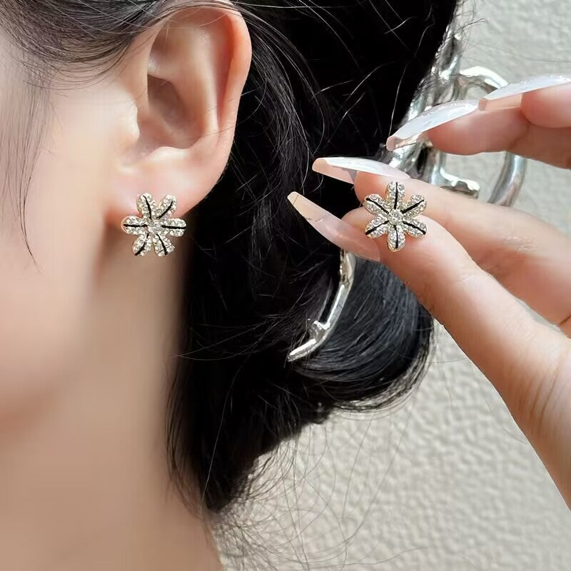 E15,925 Silver Needle Earrings  A