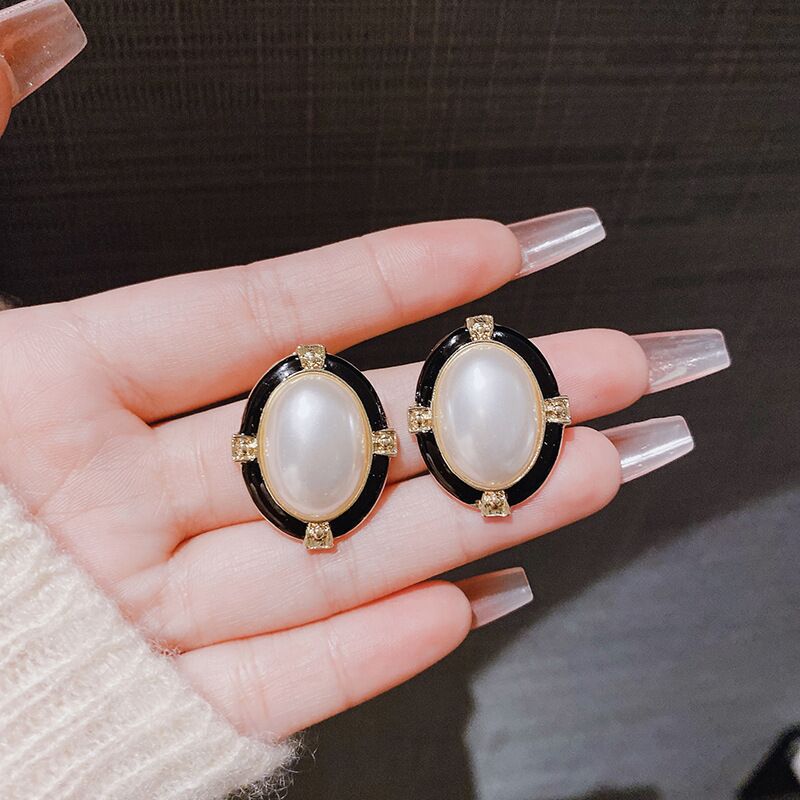 E15,925 Silver Needle Earrings  A