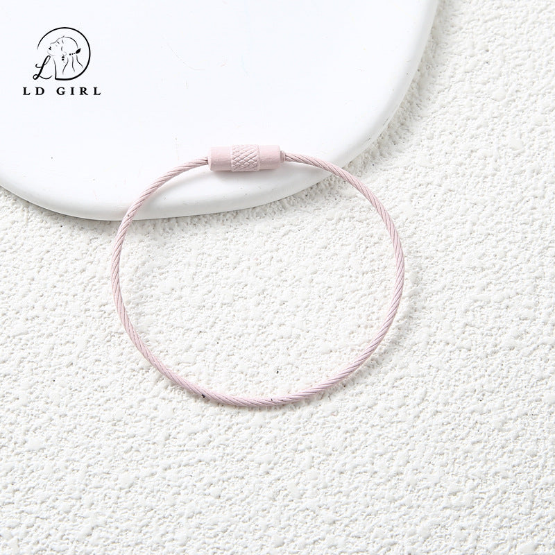 A candy colored wire rope ring