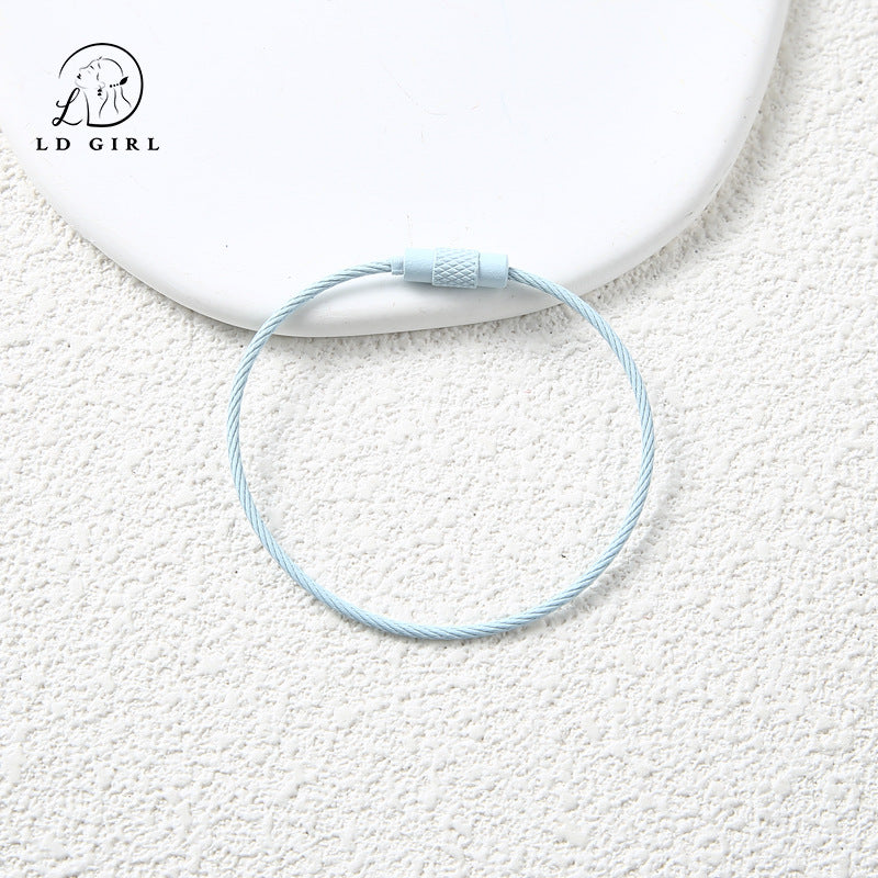 A candy colored wire rope ring