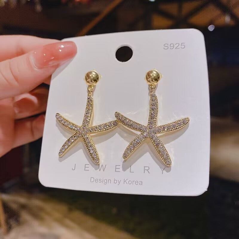 E15,925 Silver Needle Earrings  A