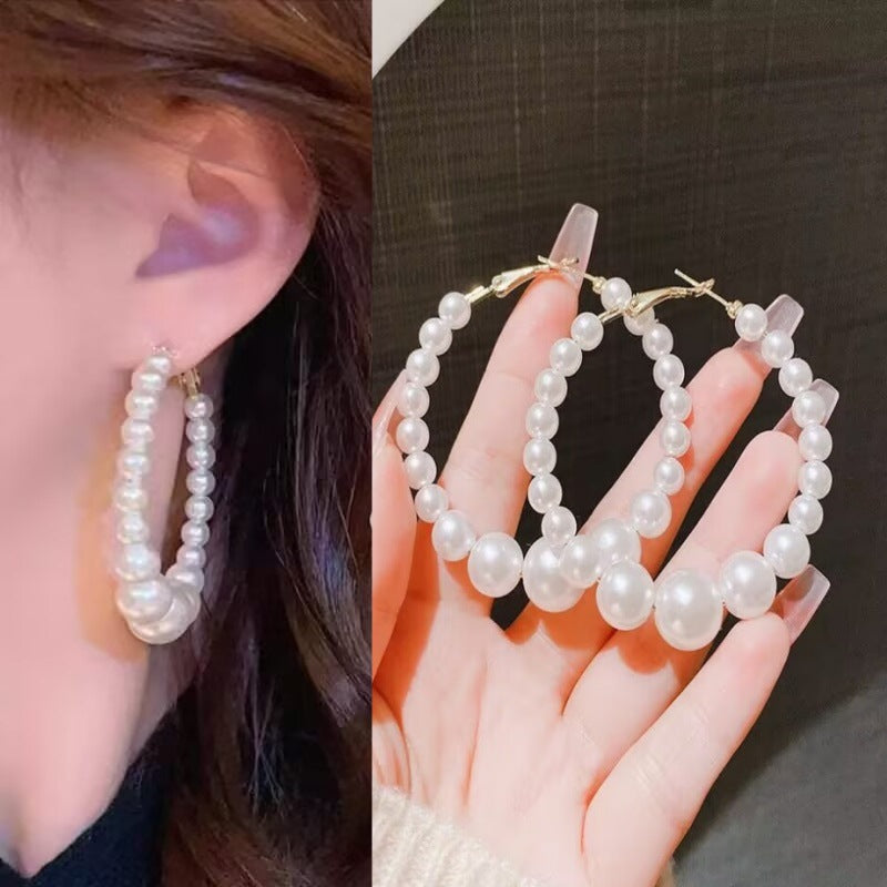 E15,925 Silver Needle Earrings  A