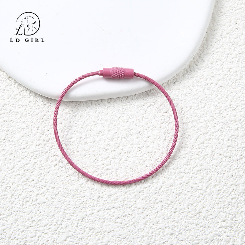 A candy colored wire rope ring