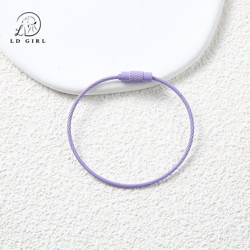 A candy colored wire rope ring