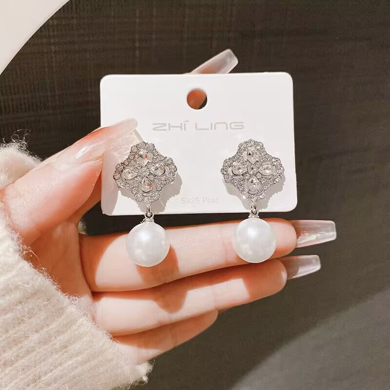 E15,925 Silver Needle Earrings  A